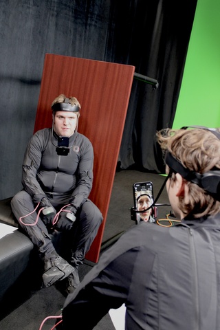 Student actors wearing motion capture suits for animation