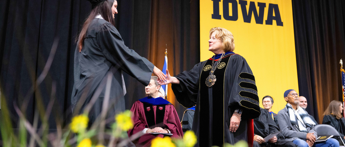 President Wilson congratulating a student at commencement