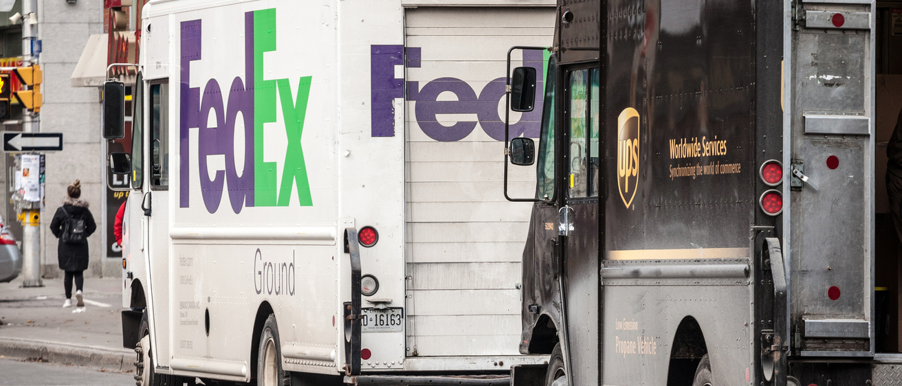 FedEx and UPS delivery trucks