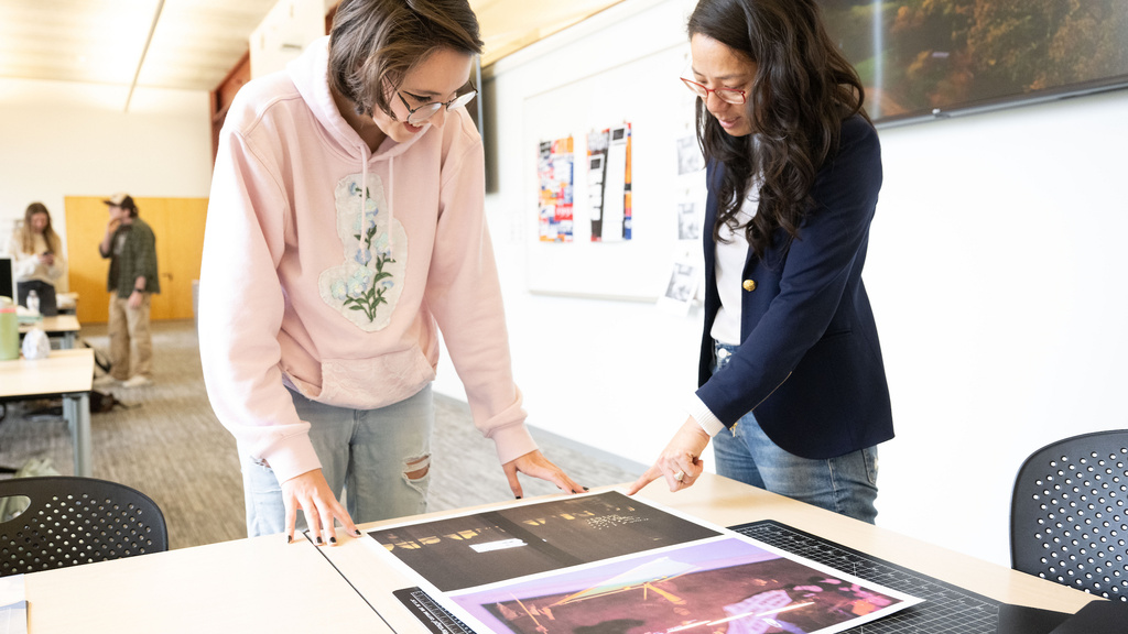Student and professor working on a graphic design project