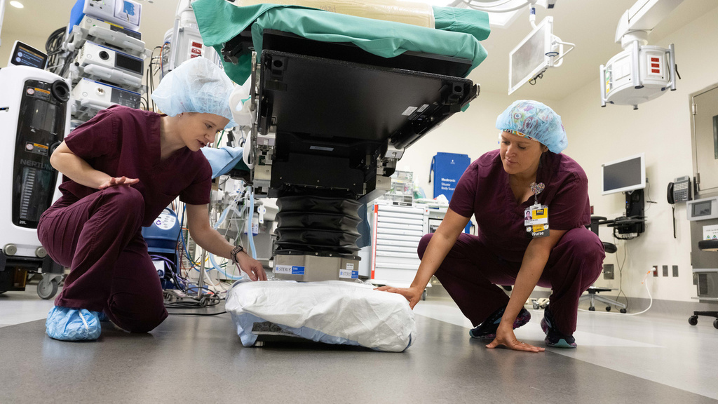 Nurses modifying some medical equipment for added efficiency
